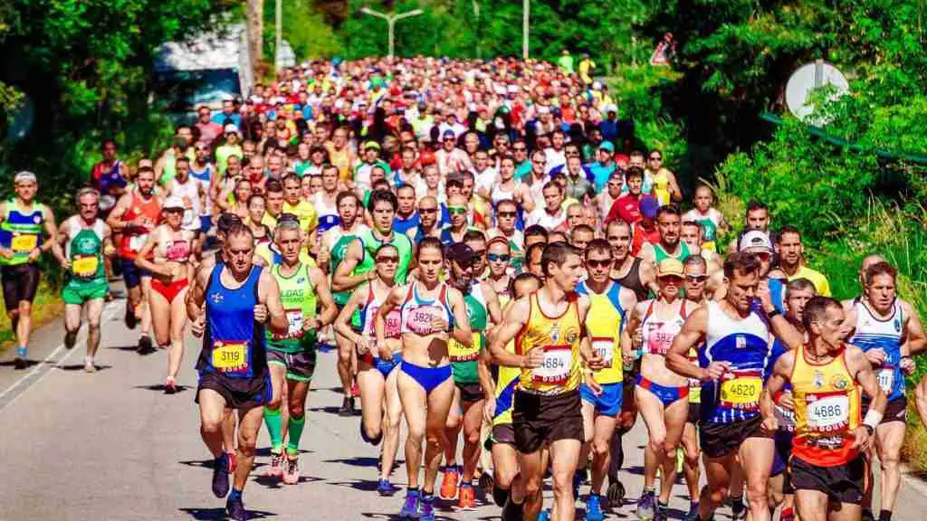 Optimized Marathons people running on a road What Types of Running Races Are There and Which one is right for you?